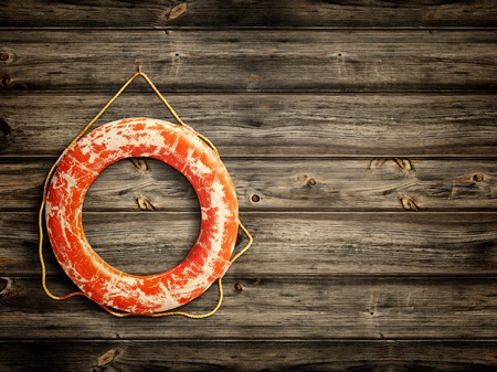 lifebuoy at wooden background, copyspace for your textの写真素材