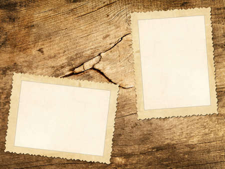 Old photos over the wooden backgroundの写真素材