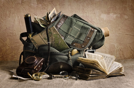 Still life with an old backpack and travel accessories  The elements used for this image  Map -...