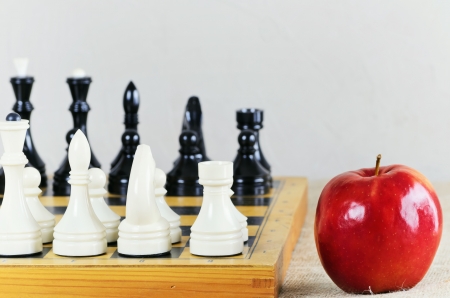 Chess On The Chess Board And Red Ripe Apple の写真素材
