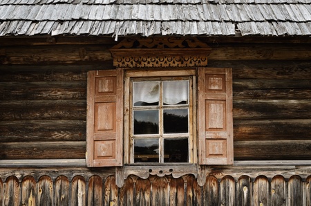 Old Window With Carved Frame And Shuttersの写真素材