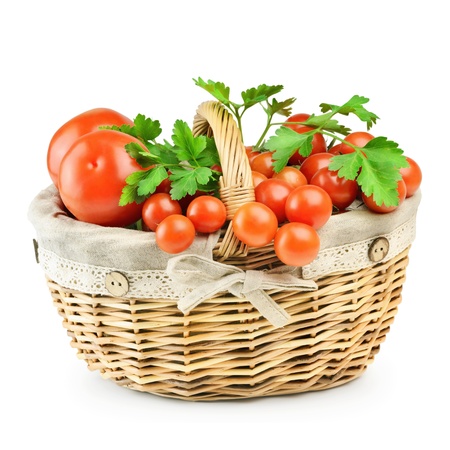 Basket With A Crop Of Tomatoes On A White Backgroundの写真素材