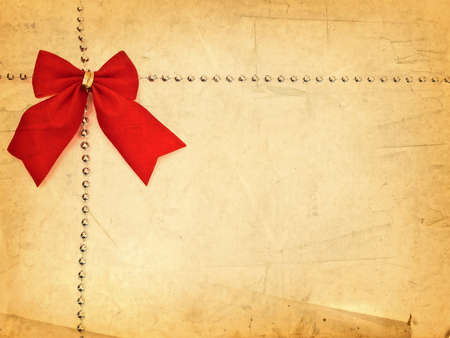 Red Bow Border With Copyspace For Your Greetings at Vintage Paper Backgroundの写真素材