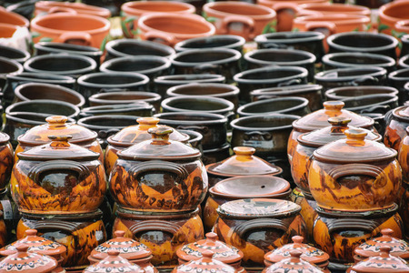 A Lot of Earthenware Crockery on the Pottery Marketの写真素材