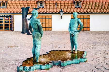 PRAGUE, CZECH REPUBLIC - JULY 17, 2012: Peeing Statues, by Czech Sculptor David Cerny beside to the Museum of Franz Kafka in the yard of Hergetova Cihelna.のeditorial素材