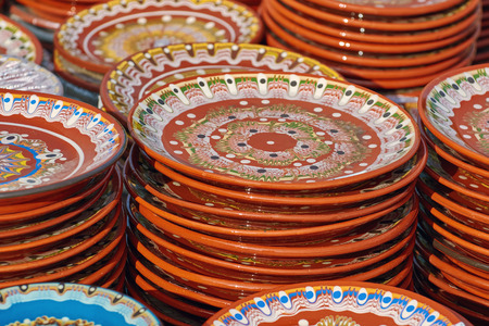 A Lot of Earthenware Crockery on the Pottery Marketの写真素材