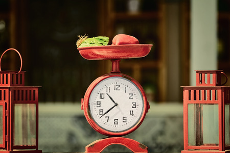 Old Clock Stylized Like Retro Scale with Vegetables on themの写真素材