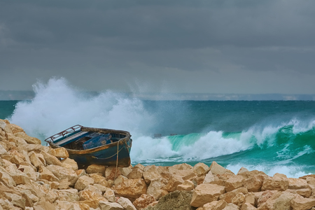Boat on the Stony Shore of Black Sea in Varna, Bulgariaの写真素材