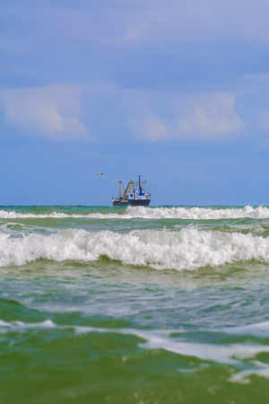 Waves on the Black Sea. Cargo Ship on Horizonの写真素材