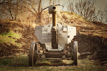 An Old Artillery Gun in the Fieldの写真素材