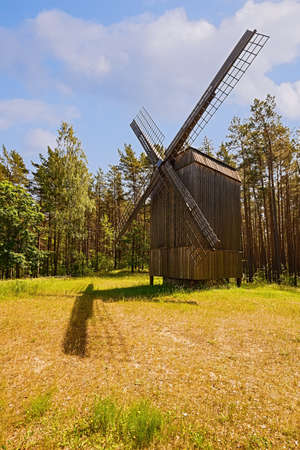 Old wooden windmill in rural area, Riga, Latviaの写真素材