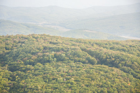 several mountain ranges, hidden in the hazeの写真素材