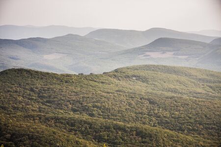 several mountain ranges, hidden in the hazeの写真素材