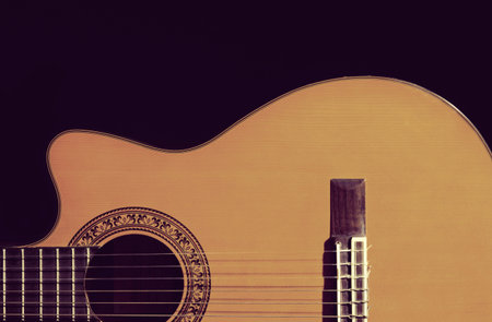 Independent on black background guitar under the curve beauty