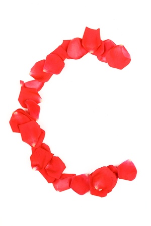 Beautiful made from red Rose petals Letter isolated on a white backgroundの写真素材