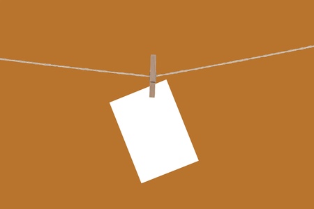 Blank paper cards hanging on clothespinsの写真素材