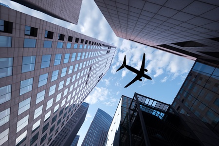 the airplane with the city scene backgroundの写真素材