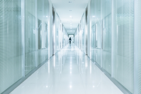 Businessmen going along corridor inside office buildingのeditorial素材