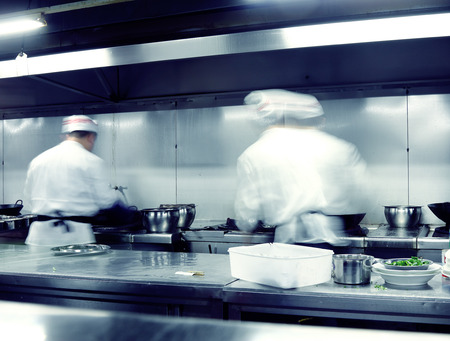 motion chefs of a restaurant kitchenの写真素材