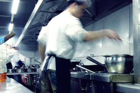 motion chefs of a restaurant kitchenの写真素材