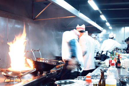 motion chefs of a restaurant kitchenの写真素材