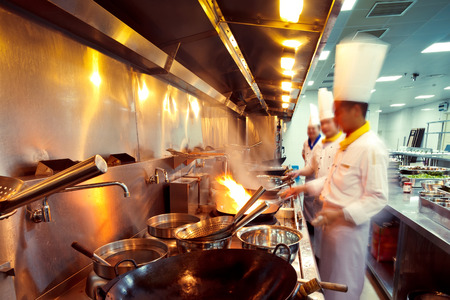 motion chefs of a restaurant kitchenの写真素材