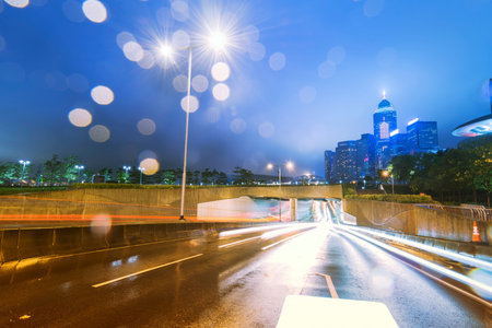 traffic with blur light through city at nightの写真素材