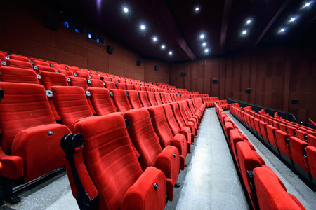 Empty movie theater with red seats