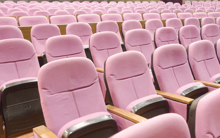 Empty movie theater with red seatsの写真素材