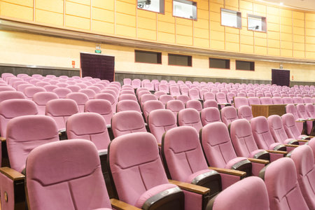 Empty movie theater with red seats