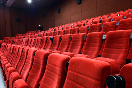 Empty movie theater with red seatsのeditorial素材
