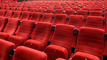Empty movie theater with red seats