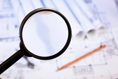 Magnifying glass and blueprint