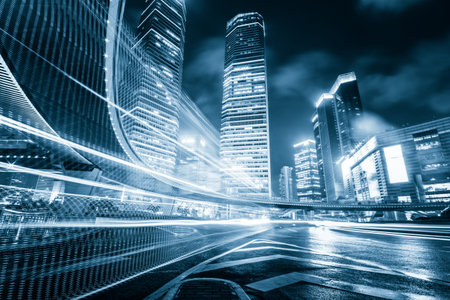 the light trails on the modern building background in shanghai china.