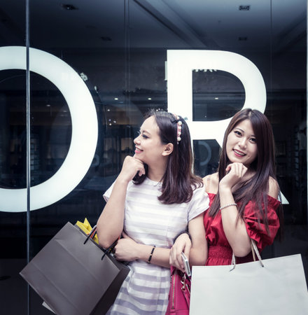 Beautiful young women shopping in a clothing store