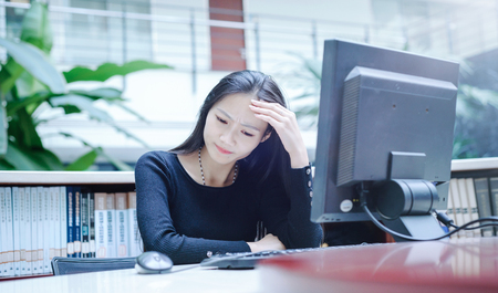 Girl working on the computerの写真素材