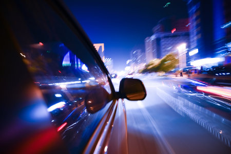 Car driving fast down in the city