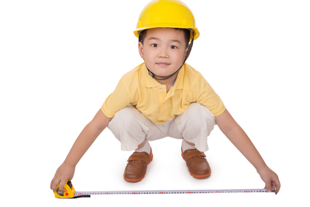 Adorable future architect over a white backgroundの写真素材