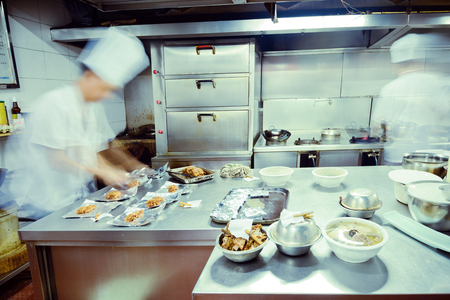 motion chefs of a restaurant kitchenのeditorial素材