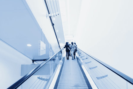 Blue moving escalator in the office hall perspective view