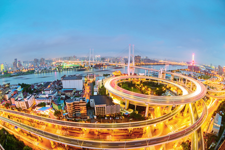 shanghai elevated road junction and interchange overpass at nightの写真素材