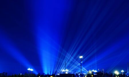 Light beams in a city at nightの写真素材