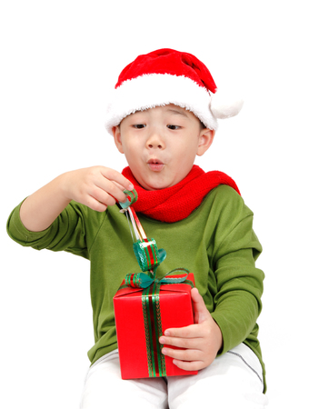 Little boy with Christmas gift boxの写真素材