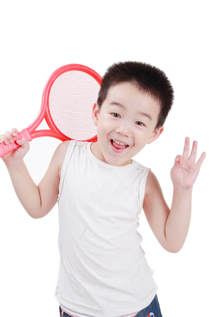 Little boy holding tennis racketの写真素材