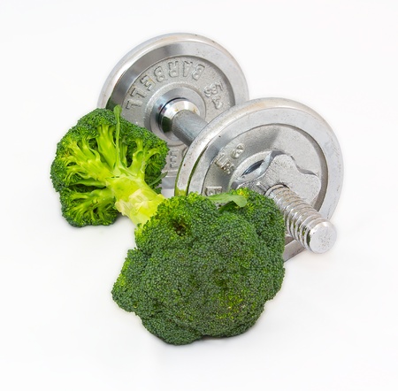 Dumbell made of Broccoli on white background.の写真素材