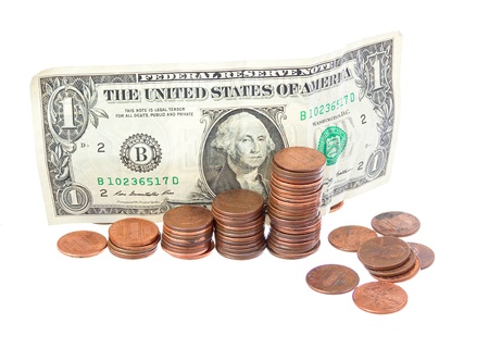 Stack of pennies isolated on white background の写真素材