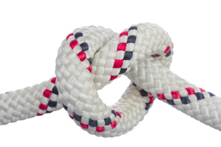 Heart-shaped knot on white background as symbol of long-lasting relations 