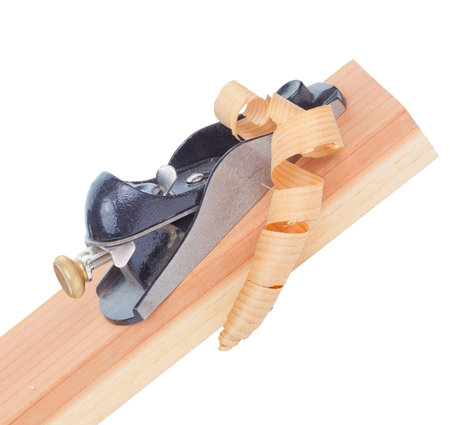 Wood planer and redwood plank isolated on white.