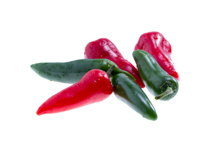 Red and green jalapeno peppers isolated on white background