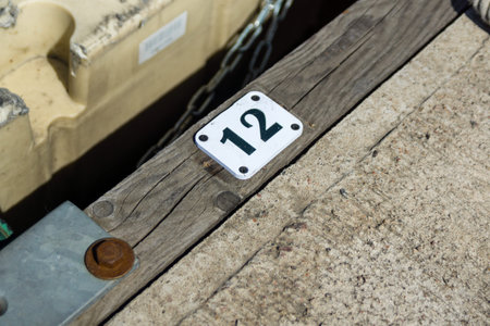 A white sign with 12th place indicates parking